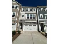 Charming townhouse with a two-car garage and neutral colored exterior at 2299 Bay Minette Sta # 537, Apex, NC 27502