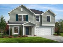 Charming two-story home with blue shutters and a well-manicured lawn showcasing curb appeal at 235 Norman Ave, Lillington, NC 27546