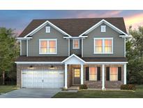 Charming two-story home with gray siding, brick accents, covered porch, and attached two-car garage at 344 Bridle Brook Way, Fuquay Varina, NC 27526