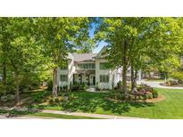 Charming two-story home with landscaped yard, beautiful lawn, and mature trees providing shade and curb appeal at 1208 Hunting Ridge Rd, Raleigh, NC 27615