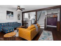 Open-concept living room showing the bright decor and stairs leading to the second floor at 2805 Fayetteville St, Durham, NC 27707