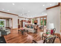 Bright open-concept living room with hardwood floors and natural light at 289 Stoneview, Pittsboro, NC 27312