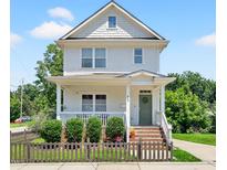 Charming two-story home featuring a welcoming front porch, well-manicured landscaping, and a classic architectural style at 309 S Haywood St St, Raleigh, NC 27601