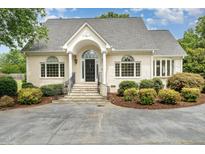 Charming one story brick home with a landscaped yard and driveway at 600 Driftwood Dr, Gibsonville, NC 27249
