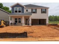New two-story home featuring mixed siding, open garage and unfinished front yard at 1143 Winding Spring Dr, Mebane, NC 27302