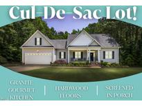 Charming single-story home with a well-manicured lawn and a spacious two-car garage on a cul-de-sac lot at 123 Holiday Island Dr, Garner, NC 27529