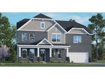 Charming two-story home features gray brick, shaker siding, covered front porch, and a two-car garage at 2329 Horton Park Dr, Apex, NC 27539