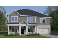 Charming two-story home featuring a covered front porch and a two-car garage at 2341 Horton Park Dr, Apex, NC 27539