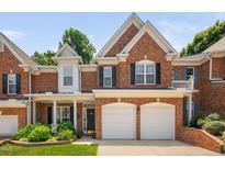 Beautiful brick home with a two-car garage, black shutters, and manicured landscaping at 3619 Lion Ridge Ct, Raleigh, NC 27612