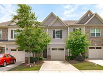 Charming townhouse with attached garage and well-maintained landscaping at 127 Bowerbank Ln, Apex, NC 27539