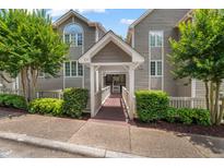 Inviting condos with a walkway entrance and mature trees in a well-kept community at 313 Glen Echo Ln # J, Cary, NC 27518