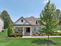 Charming home featuring a covered front porch, landscaped yard, and fresh curb appeal at 475 Long View Dr, Franklinton, NC 27525
