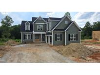New construction home with a green exterior, black shutters and a lawn that will be installed at 55 Livingston Ln, Spring Hope, NC 27882