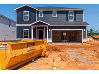 New two-story home under construction, showing siding, garage, and construction site at 736 Deschutes Dr, Garner, NC 27529