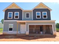 New construction home featuring a two-car garage and classic design elements at 956 Bombardier Ln, Spring Hope, NC 27882