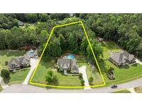 Spacious home on wooded lot with pool and outdoor living space at 1412 Wakefield Farm Rd, Zebulon, NC 27597