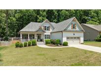 Charming single-Gathering home with a landscaped front yard and welcoming two-car garage at 230 Paddy Ln, Youngsville, NC 27596