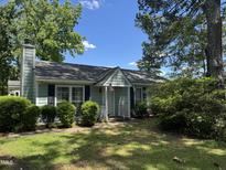 Charming single-story home featuring a cozy entrance and a well-manicured lawn at 8405 Falcon Crest Cir, Angier, NC 27501