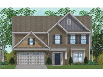 Charming two-story house with stone accents, a covered entry, gable roof, and a two car garage at 33 Black Walnut Dr # 185, Garner, NC 27529