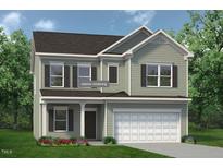 Charming two-story home featuring a neutral color palette and a two-car garage at 334 Deodora Ln, Cameron, NC 28326