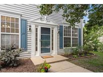 Charming front door entrance featuring decorative trim and sidelights at 402 Halls Mill Dr, Cary, NC 27519