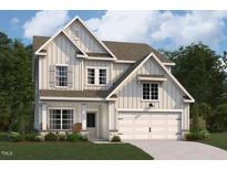 Charming two-story home with board and batten siding, attached two-car garage, and a well-manicured lawn at 4301 Emeline Way # 15, Fuquay Varina, NC 27526