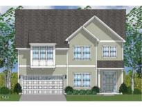 Charming two-story home featuring a light color scheme, symmetrical windows, and attached two-car garage at 61 Black Walnut Dr # 188, Garner, NC 27529