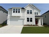 Charming two-story home with white siding, a red front door, and an attached two-car garage at 61 Black Walnut Dr # 188, Garner, NC 27529