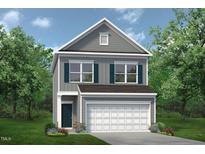 Charming two-story home with a gray exterior, complemented by a two-car garage and manicured landscaping at 136 Bruce Dr Dr, Dunn, NC 28334
