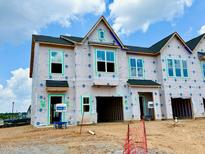 New construction home featuring a modern design with ample windows for natural light at 153 Ripple Way # 208, Clayton, NC 27520