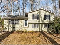 Charming two-story home with black shutters and well-maintained front yard landscaping at 1195 Champion Dr, Cary, NC 27511