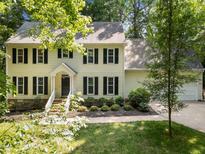 Charming two-story home featuring a well-maintained lawn and classic black shutters at 2840 Mattlyn Ct, Raleigh, NC 27613