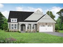 Charming home features a stone and siding exterior, a two-car garage, and a well-manicured lawn at 297 Crop Rd, Angier, NC 27501