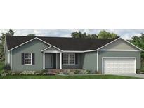Charming single-story home with a well-maintained lawn, attached garage, and inviting front porch at 4451 Poppy Mallow Ln, Oxford, NC 27565