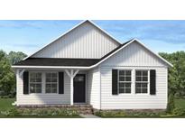 Charming one-story home featuring a classic black front door, bright white siding and black shutters at 4454 Poppy Mallow Ln, Oxford, NC 27565