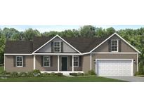 Charming one-story home with a classic architectural design, a two-car garage, and a well-manicured lawn at 4461 Poppy Mallow Ln, Oxford, NC 27565