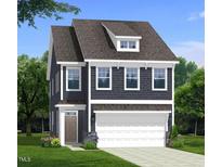 Charming two-story home featuring a two-car garage, dormer, and landscaped yard at 5208 Ranger Grove Way, Raleigh, NC 27604