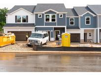 New construction townhomes featuring Hardie board siding, and attached garages at 1029 Winding Spring Dr, Mebane, NC 27302