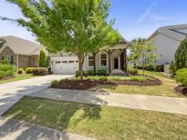 Charming single-story home featuring a landscaped front yard and a two-car garage at 1517 Chestnut Falls Rd, Wendell, NC 27591