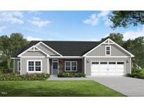 Charming one-story home with stone accents, gray siding, well-manicured lawn and an attached two-car garage at 260 Pretty Run Branch Ln, Wendell, NC 27591