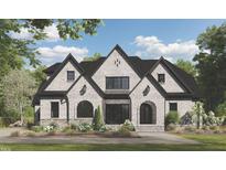 Stunning brick home with modern design and meticulously landscaped front yard offers great curb appeal at 3422 Redbud Ln, Raleigh, NC 27607