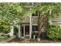 Inviting two-story home with a well-manicured lawn and charming curb appeal at 4645 Edwards Mill Rd, Raleigh, NC 27612
