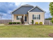Charming single-Gathering home with manicured lawn and inviting facade, great curb appeal at 1071 Turlington Rd, Dunn, NC 28334