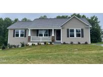 Charming single-story home with a covered front porch and well-maintained lawn at 170 Starry Sky Dr, Benson, NC 27504
