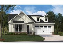 Charming two-story home featuring a white exterior, a two-car garage, and a professionally landscaped front yard at 2016 Kapalua Way # 195, Durham, NC 27703