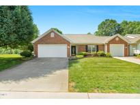 Charming single-story brick home with a well-manicured lawn and a two-car garage at 3027 Maple Ave # A-1, Burlington, NC 27215