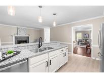 Bright kitchen featuring granite countertops, stainless steel appliances, and an open layout at 6104 New Market Way, Raleigh, NC 27609
