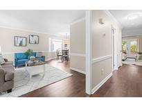 Inviting living room with modern decor, hardwood floors, and an abundance of natural light at 6104 New Market Way, Raleigh, NC 27609