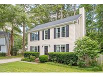 Charming two-story home with black shutters and mature landscaping at 8116 Bentwood Pl, Raleigh, NC 27615