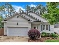 Charming one-story home with a well-maintained lawn and landscaping at 103 Kylie Savannah Ct, Cary, NC 27511